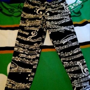 A pair of music notes leggings worn 2 times